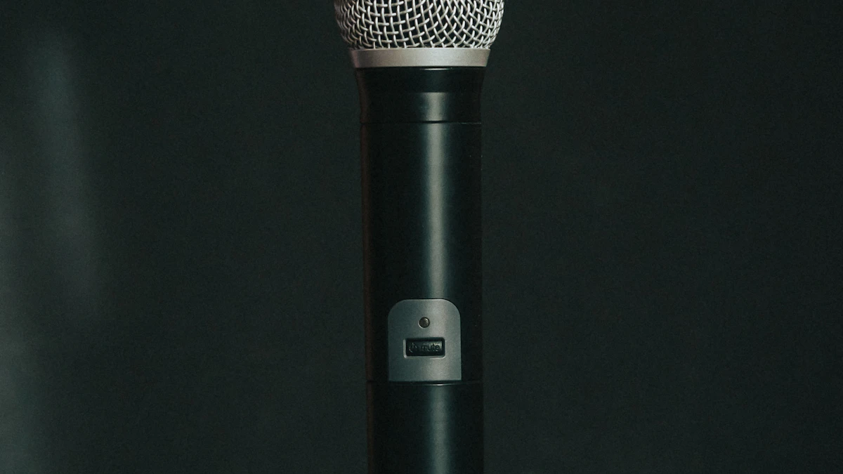 Black studio microphone on a dark table, evoking Block Dessa, the voice AI that learned to talk from speech alone