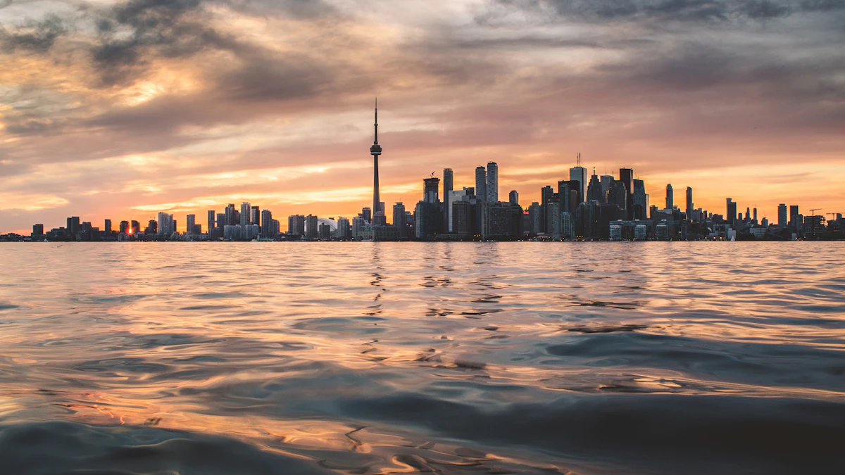 Toronto skyline with the CN Tower across Lake Ontario at golden hour, home city of AI company Cohere