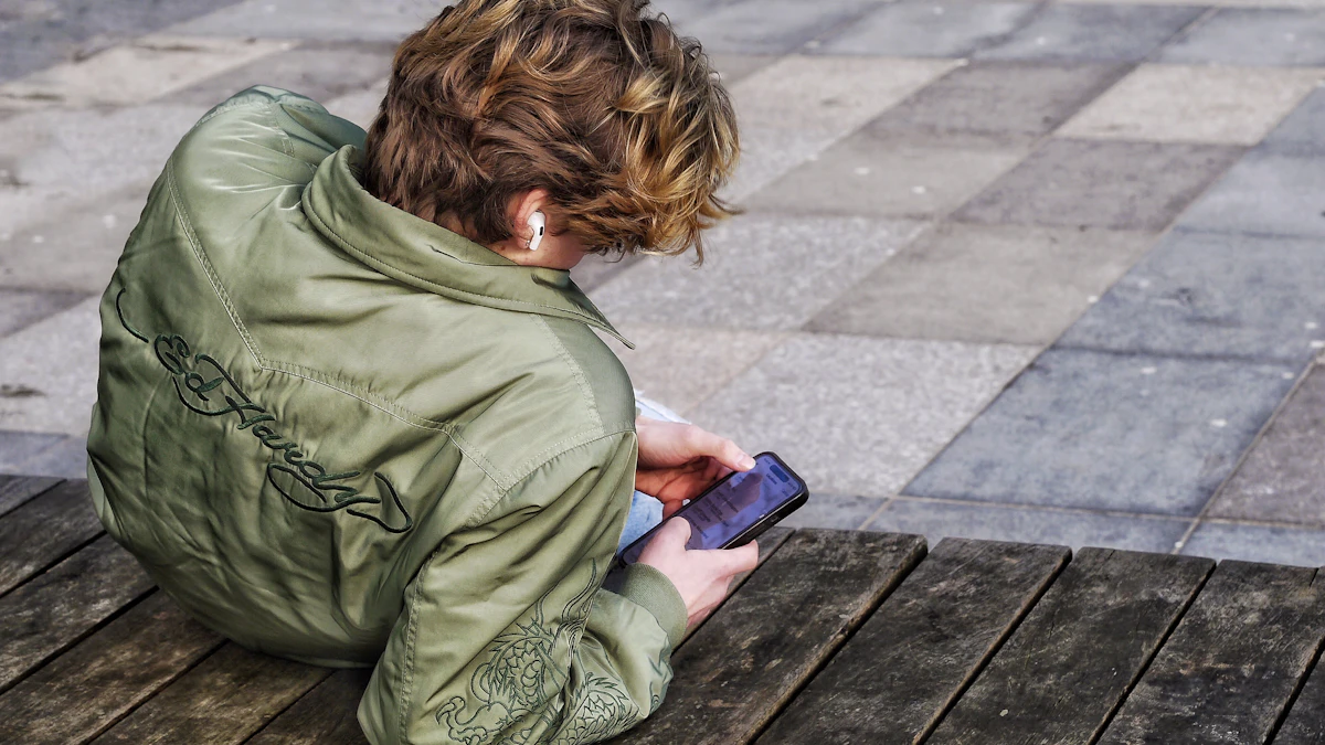Young person with curly hair scrolling a smartphone, the kind of device many teens use to open ChatGPT