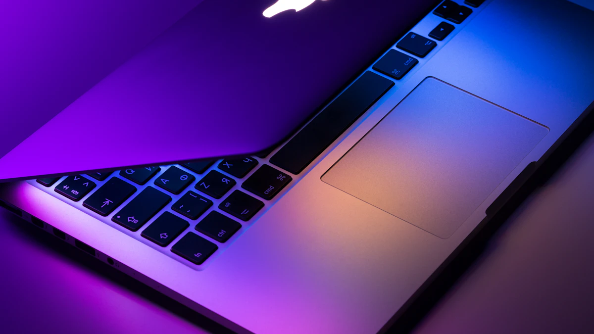 Slightly opened silver MacBook on a desk, close in design to the new 14 inch M6 MacBook Pro from Apple
