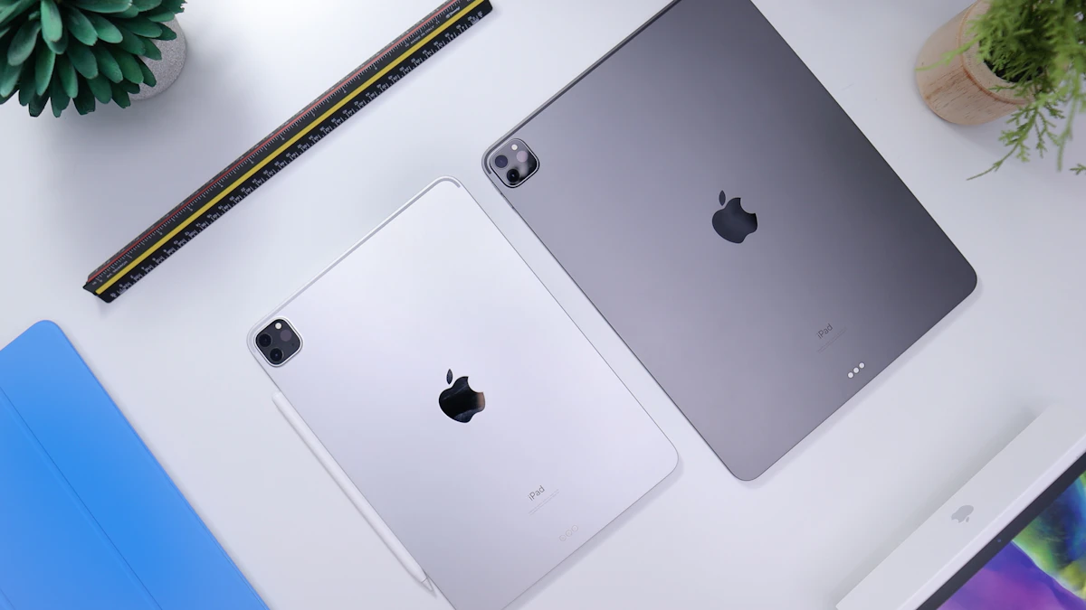 Silver iPad resting on a white table, the kind of compact Apple tablet refreshed in the new OLED iPad mini