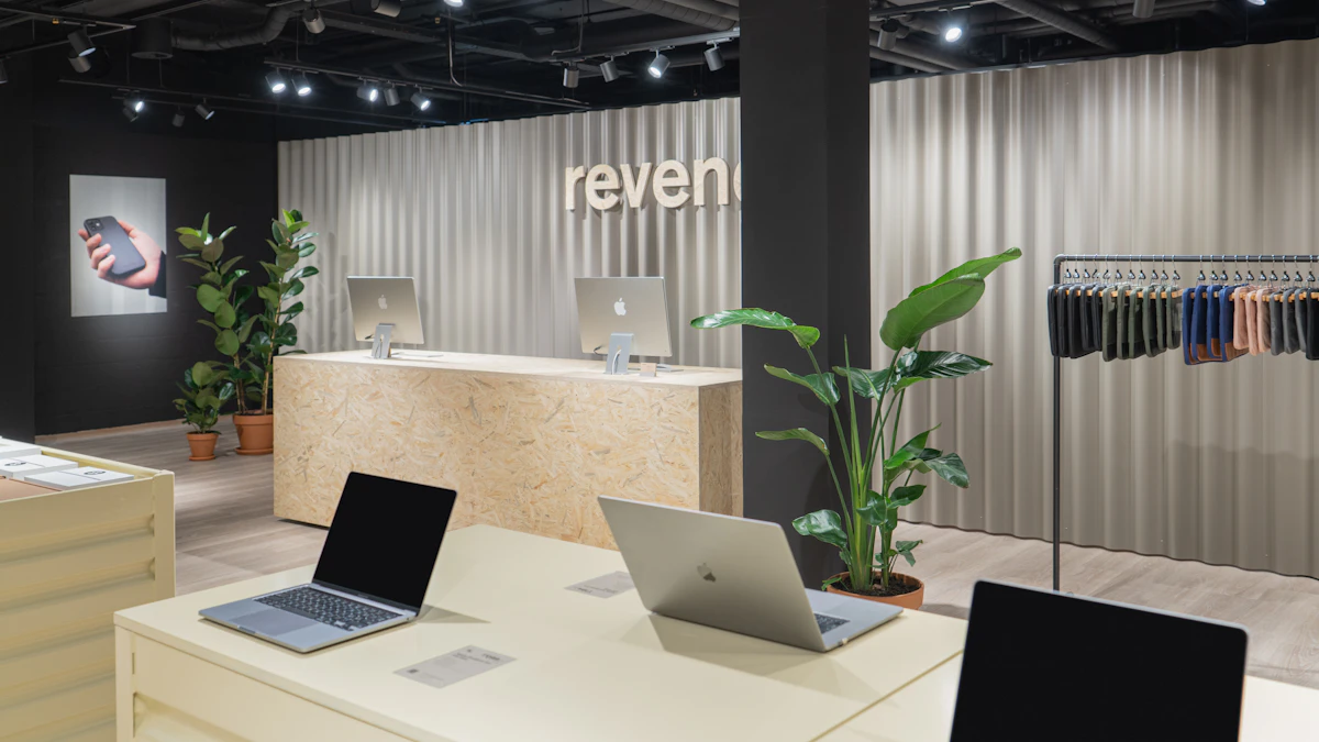 Two laptops displayed on a table inside an electronics store as global PC shipments fall amid rising memory prices