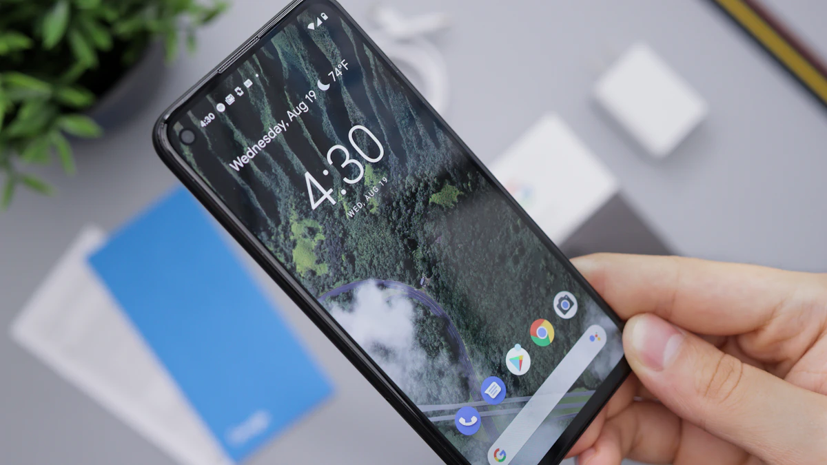 A person holding a black Android smartphone, the kind of device you can clean of malware with Play Protect and safe mode