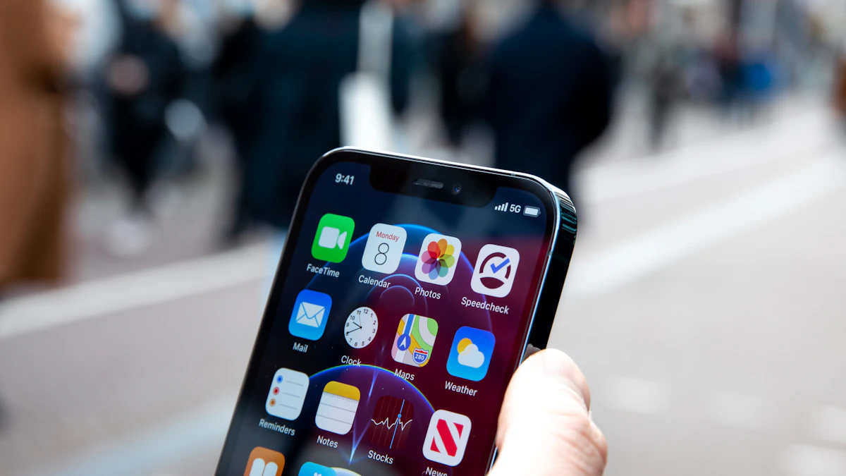 Person holding an iPhone in one hand, the kind of phone that can show fake virus alerts in Safari