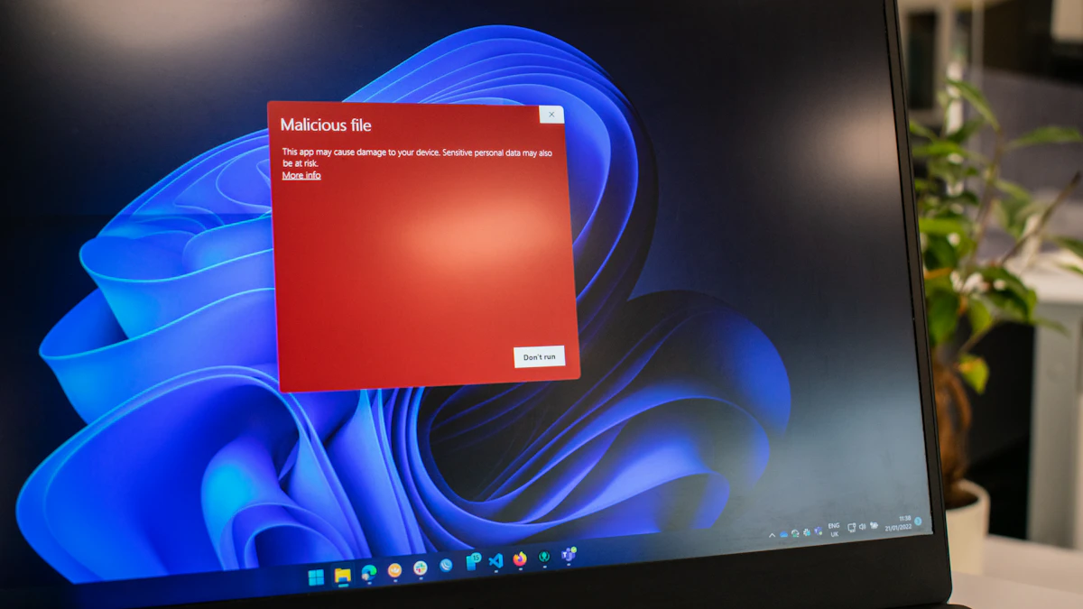Dell laptop with a bright red screen, illustrating how a malware infection can take over a computer